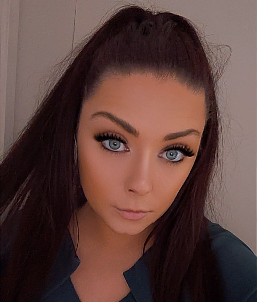 Jess at Claws Nail and Beauty, with dark hair in a high ponytail