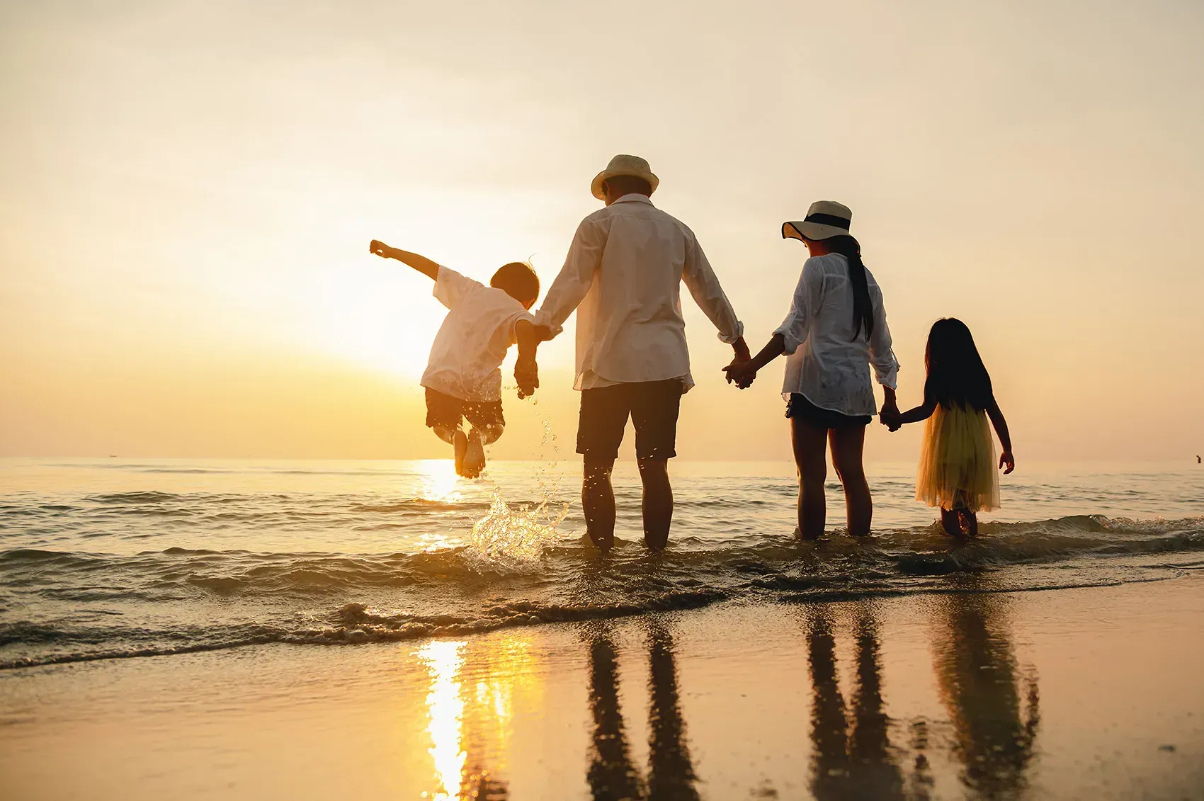 Family on the beach in Plantation, FL at sunset