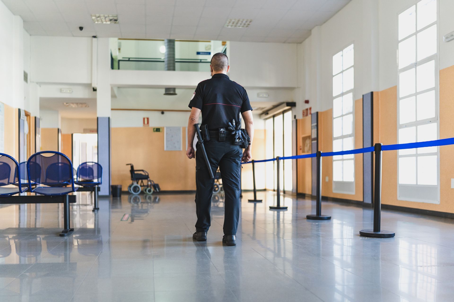A security officer with his back turned.