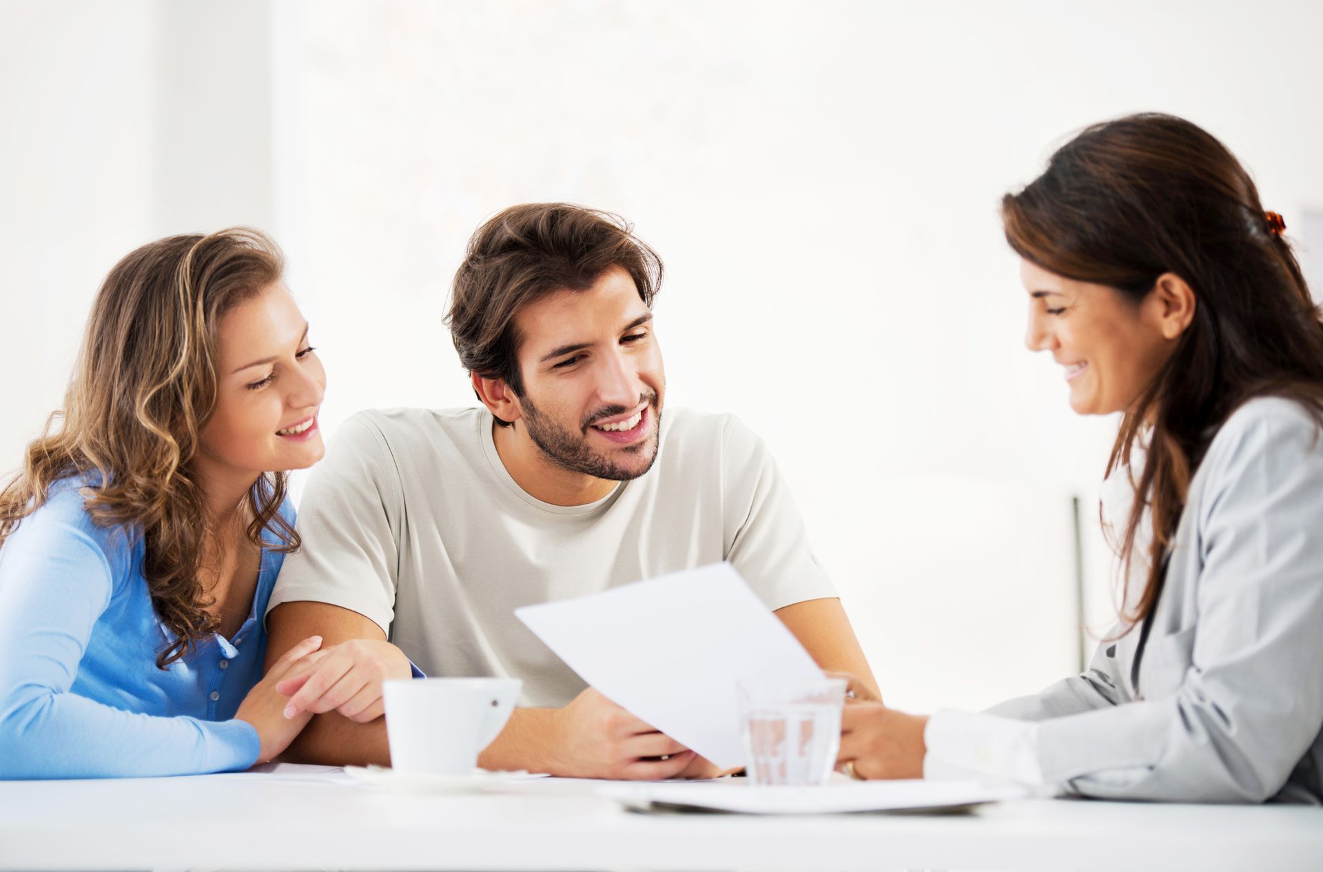 Experienced accountant assisting young couple with tax planning services in Des Moines, IA. 