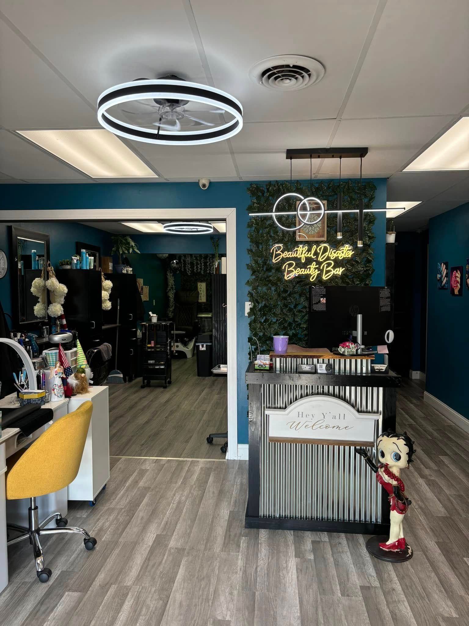 Bright salon interior with mirrors, chairs, a reception counter, and a small cartoon figure by the desk.