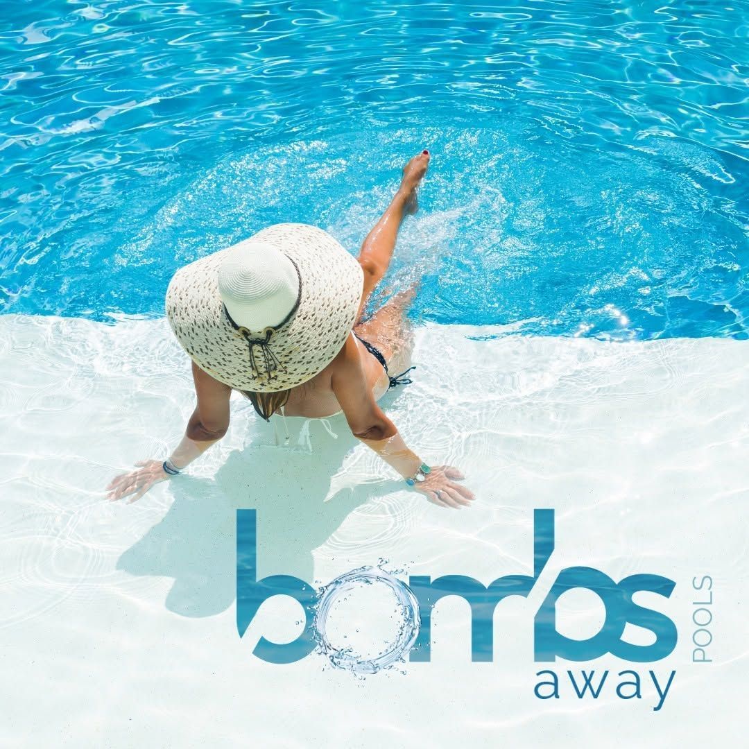 Woman in a sunhat at the edge of a blue swimming pool  — Bombs Away Pools in Coolangatta, QLD