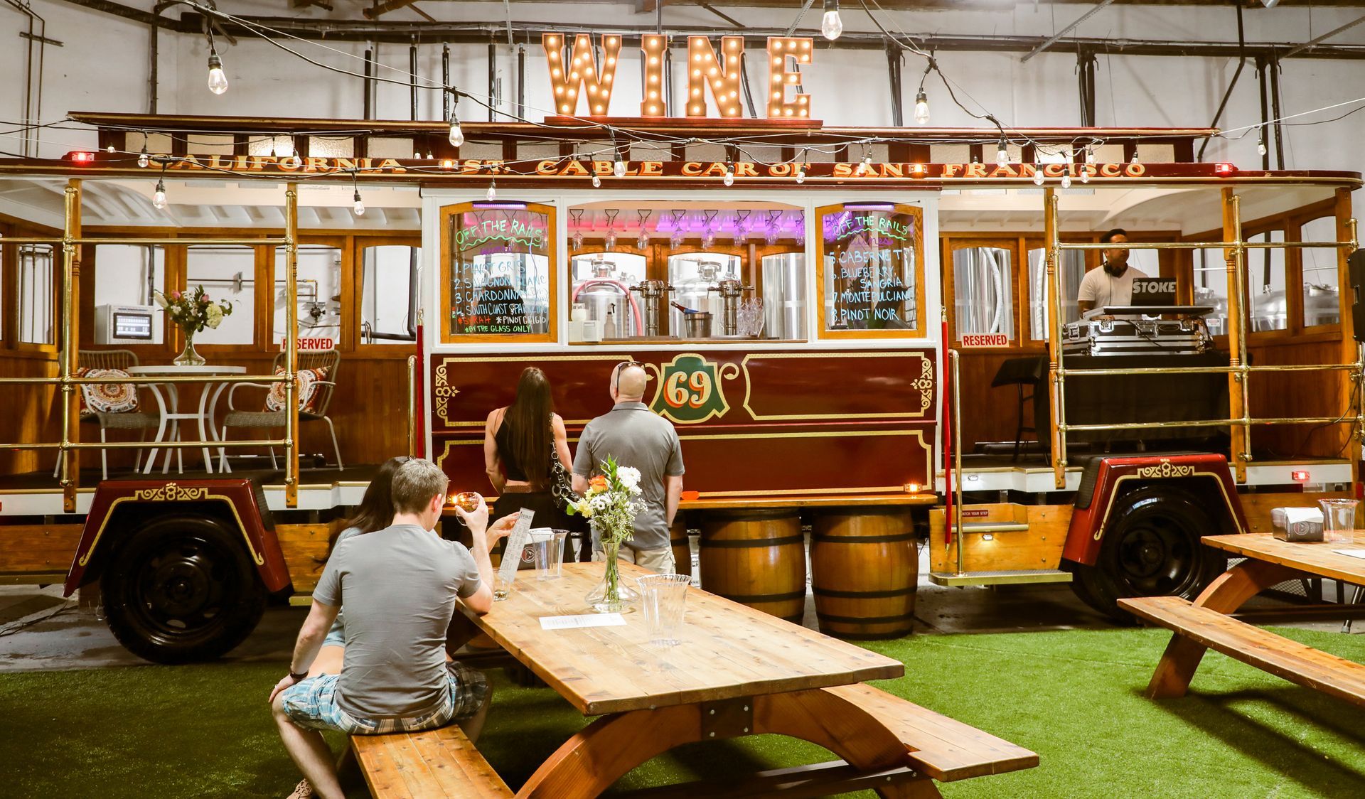 customers enjoying a drink at Black Market Brewery at Off the Rails Winery