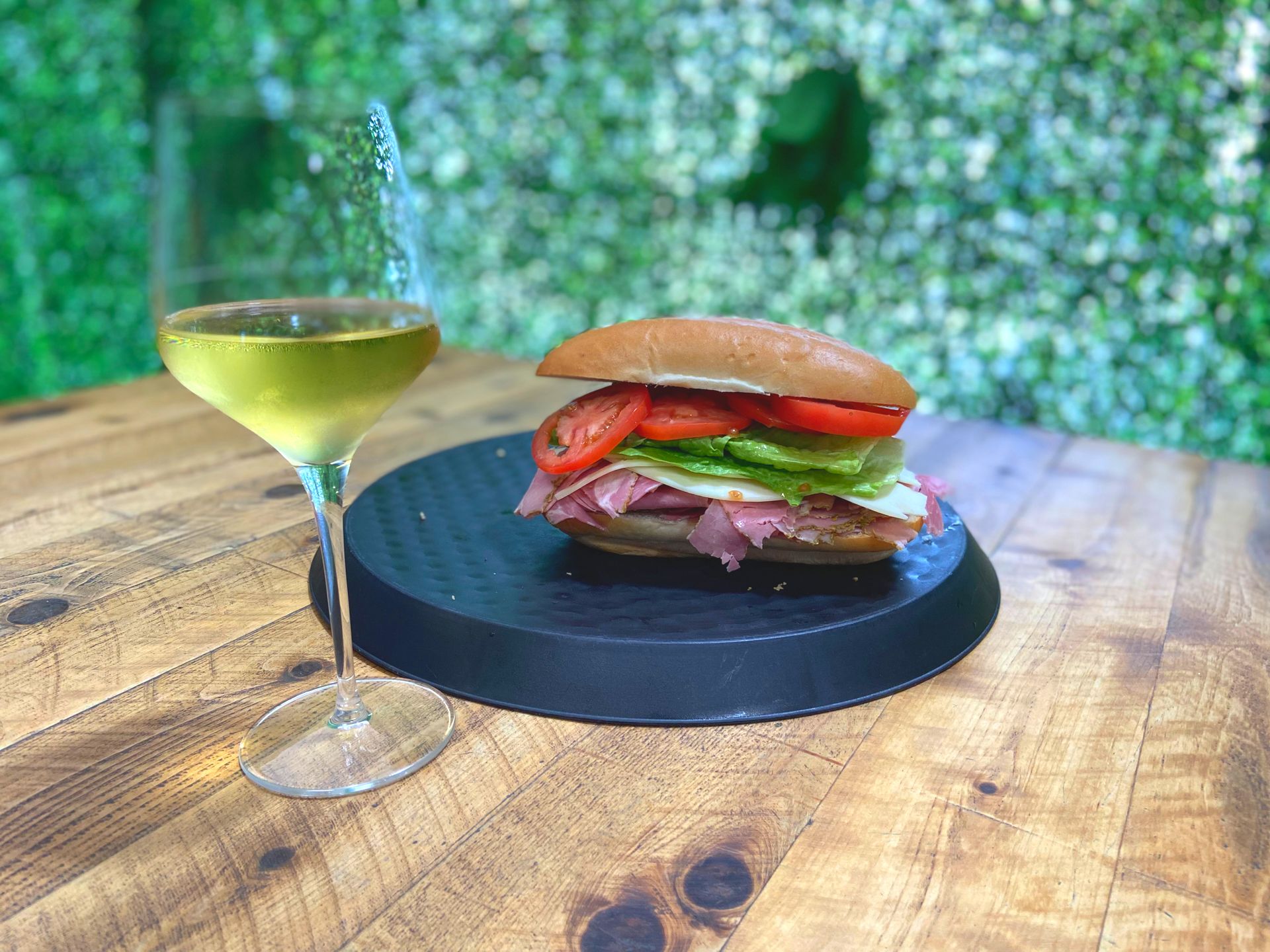 sandwich and wine glass at Off the Rails Winery