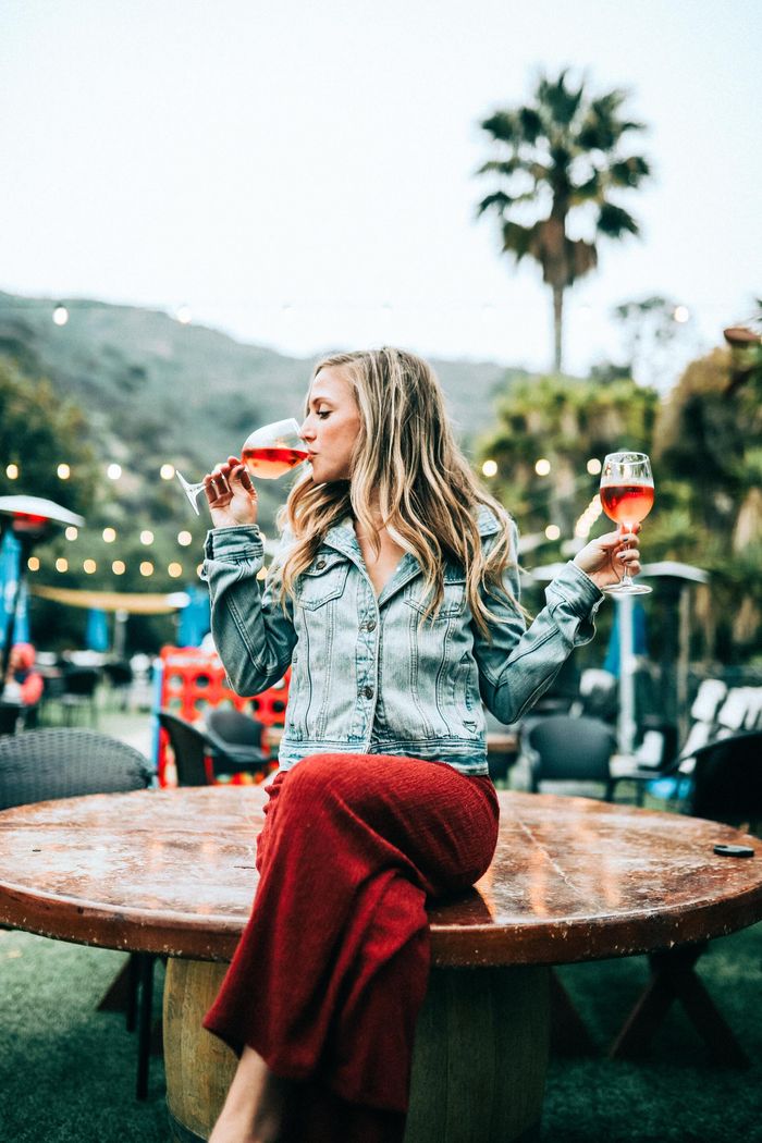 Woman holding two glass of wine