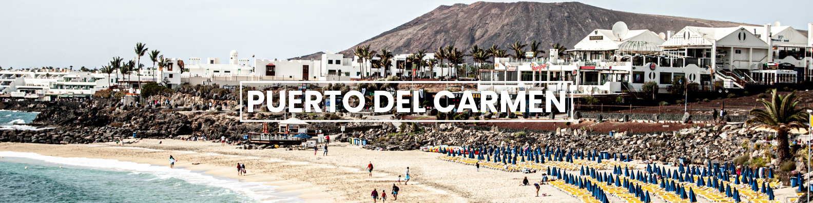 a blurry picture of a beach with the words puerto del carmen written on it .