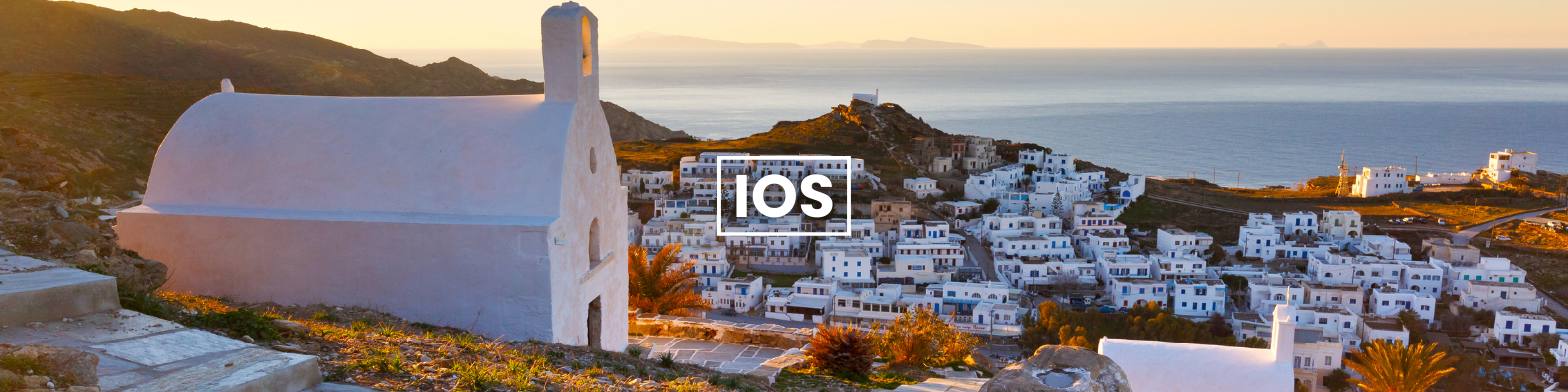 a white church is sitting on top of a hill next to the ocean . Barter's Travelnet 