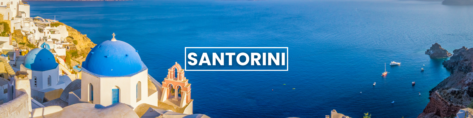 a picture of santorini with blue domes and boats in the water .