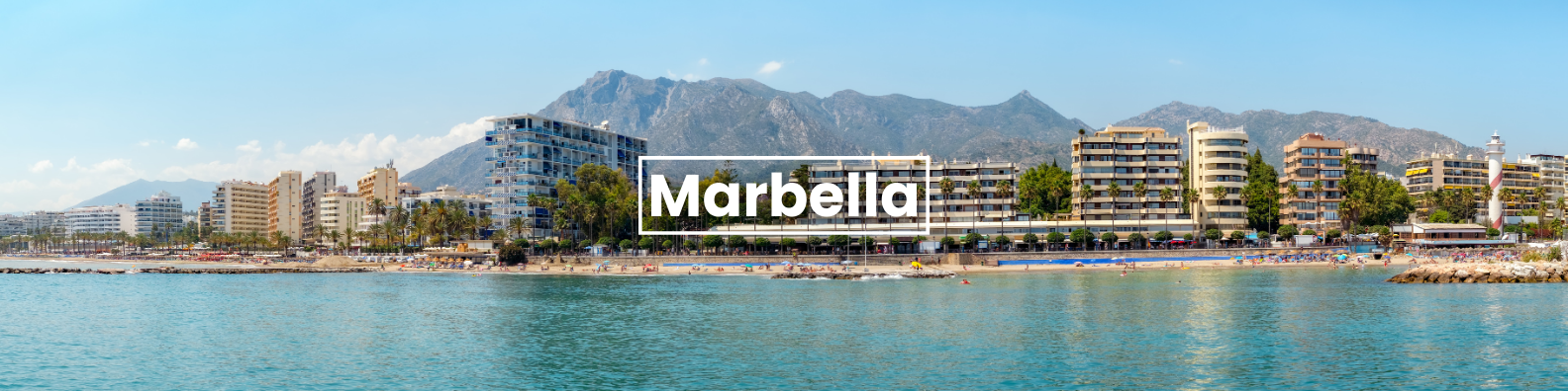 a city skyline overlooking a body of water with mountains in the background . Barter's Travelnet 