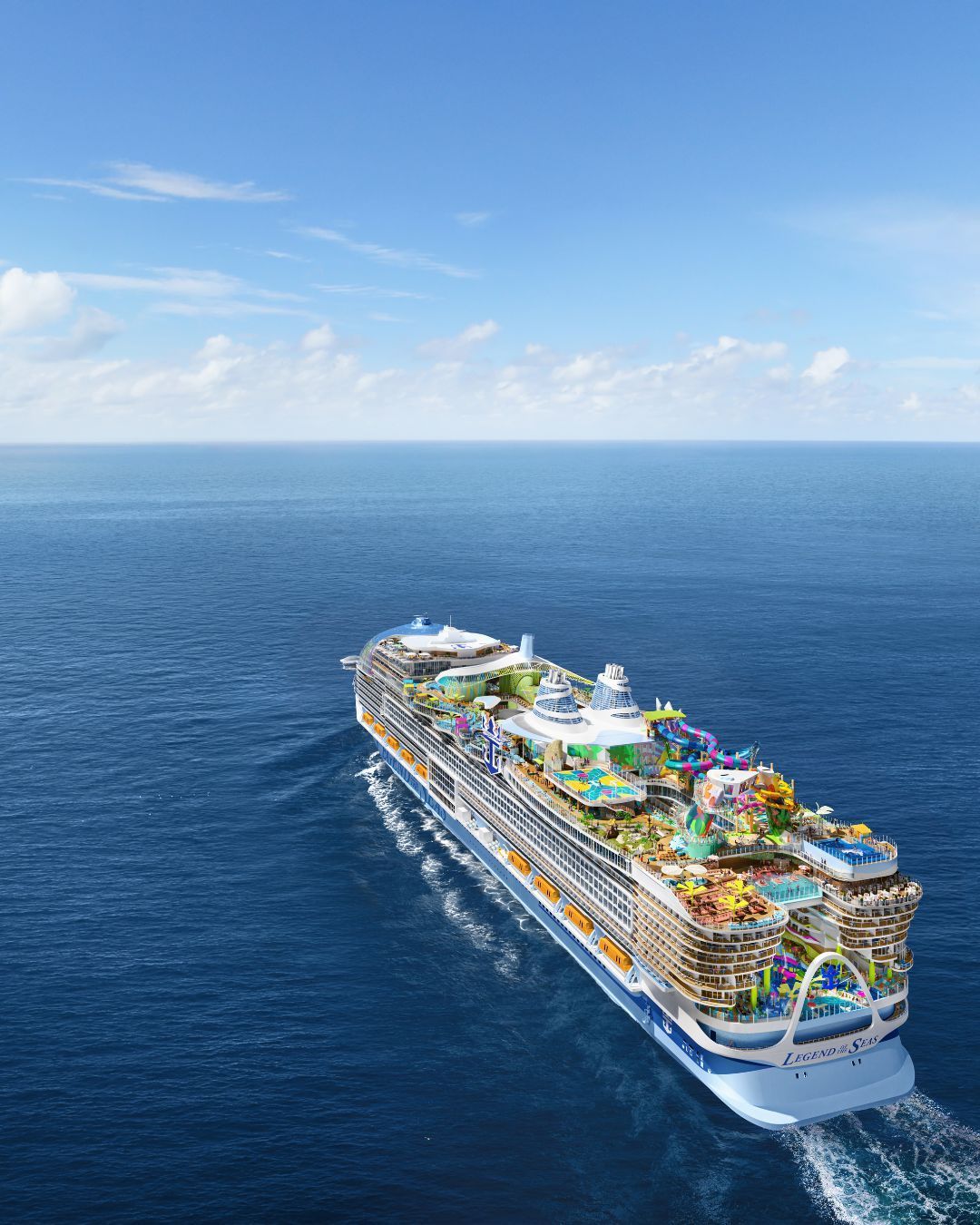 Colorful cruise ship sailing across a calm blue ocean under a clear sky