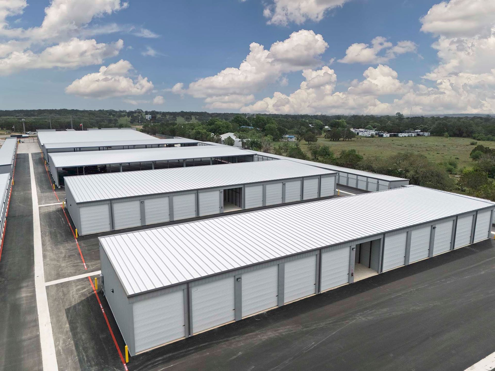 An affordable enclosed boat & RV parking building near Canyon Lake, TX at a facility with keypads, gates, and cameras