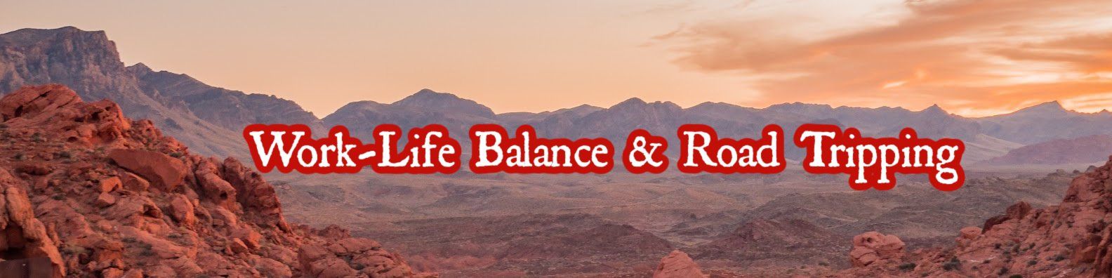 A picture of a mountain range with the words work life balance and road tripping.