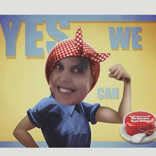 A woman flexing her muscles in front of a sign that says yes we can.