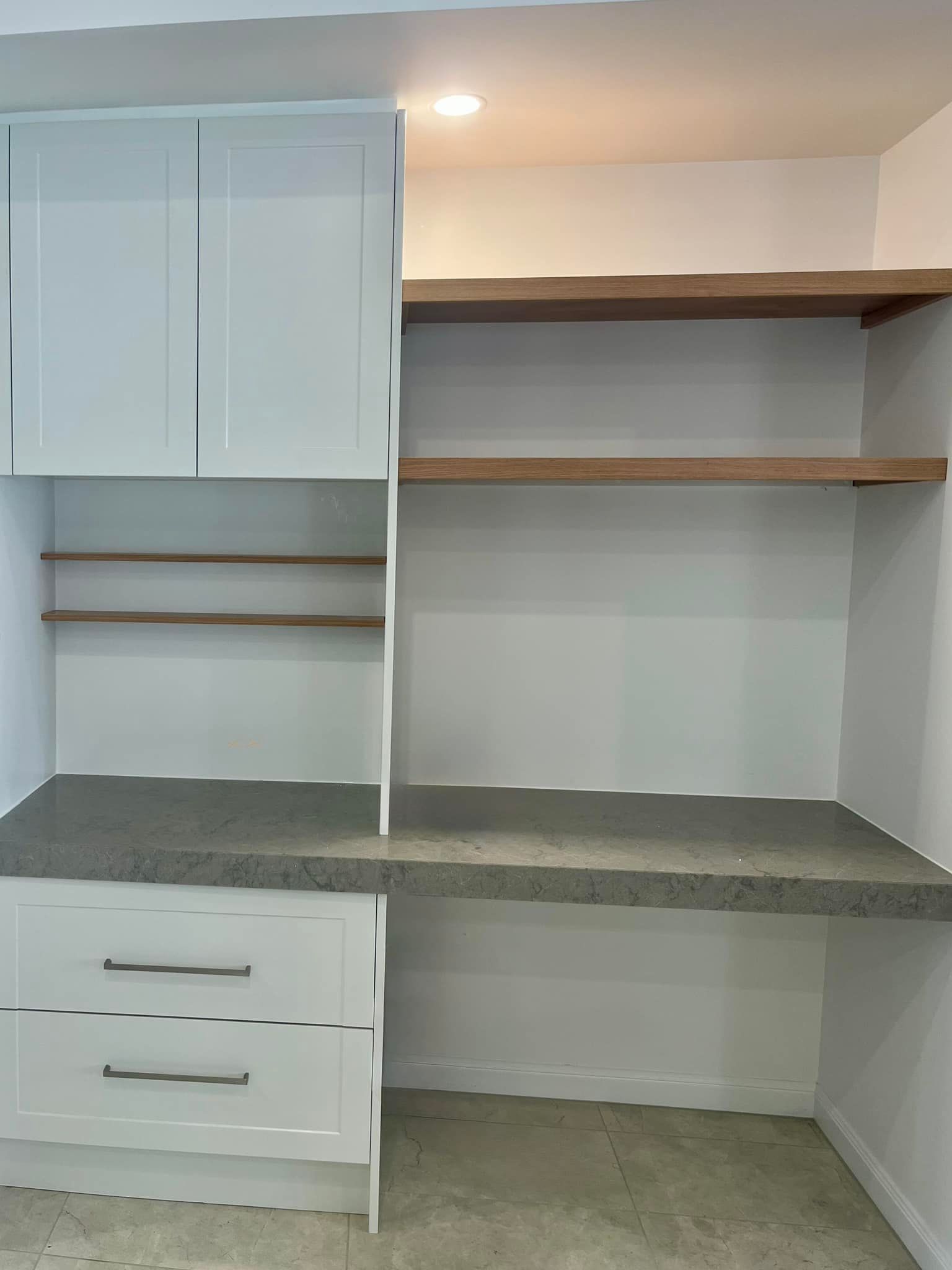 An empty room with a desk and shelves in it — Coastal Detail Joinery in Tuncurry, NSW