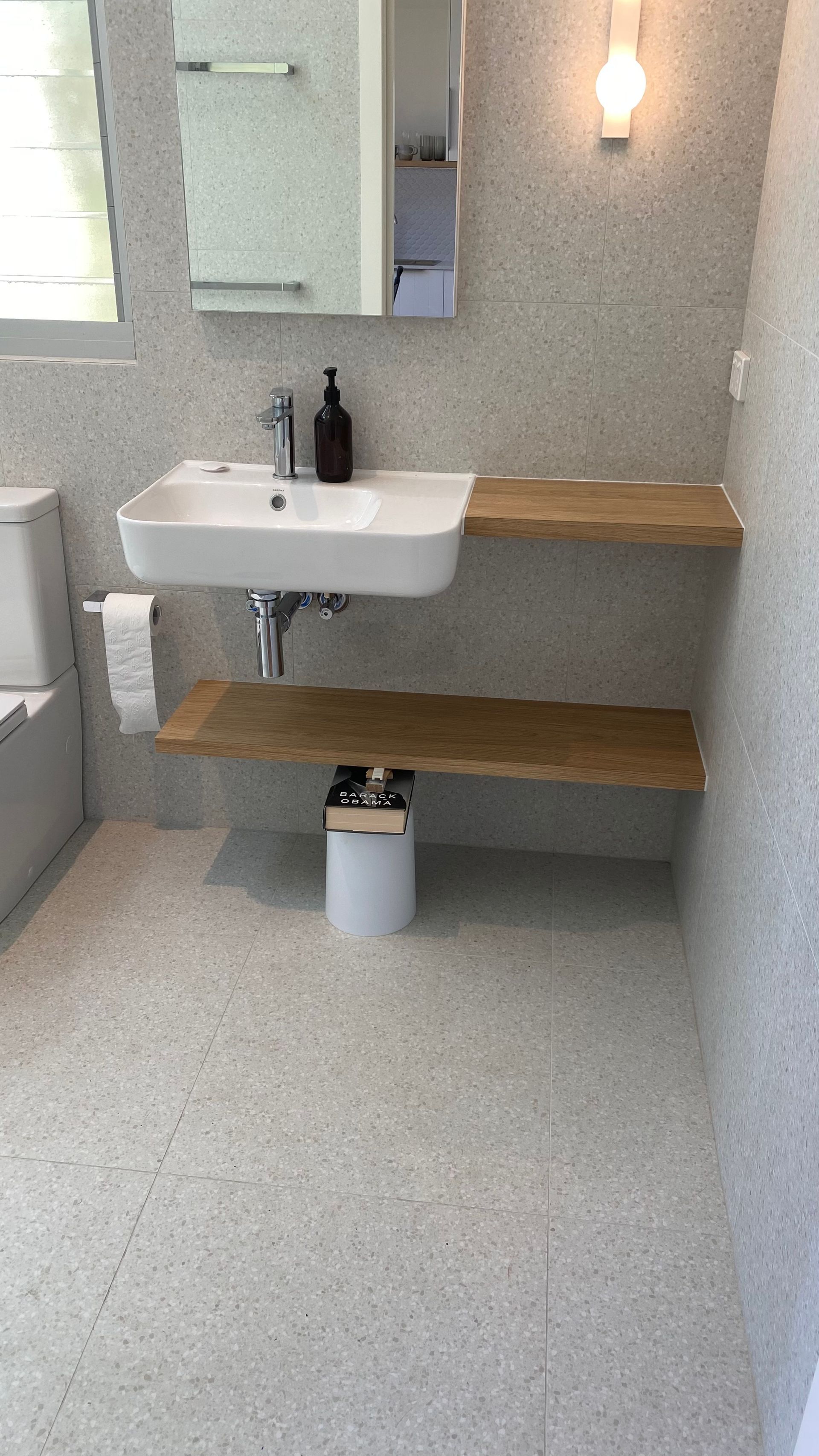 A bathroom with a sink , toilet , mirror and shelves — Coastal Detail Joinery in Tuncurry, NSW