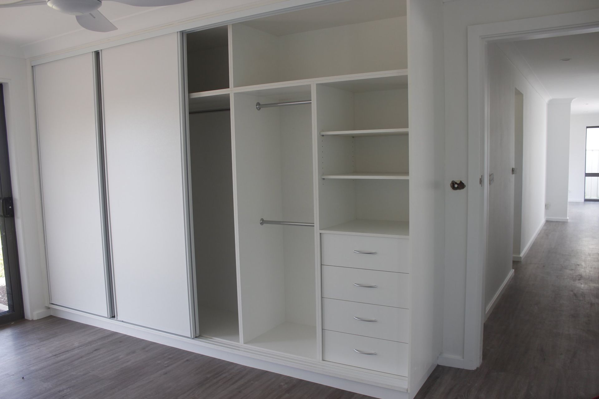 white wardrobe with drawers and sliding doors recently installed — Coastal Detail Joinery in Forster, NSW