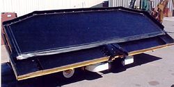 a large black and gold object is sitting on the ground .