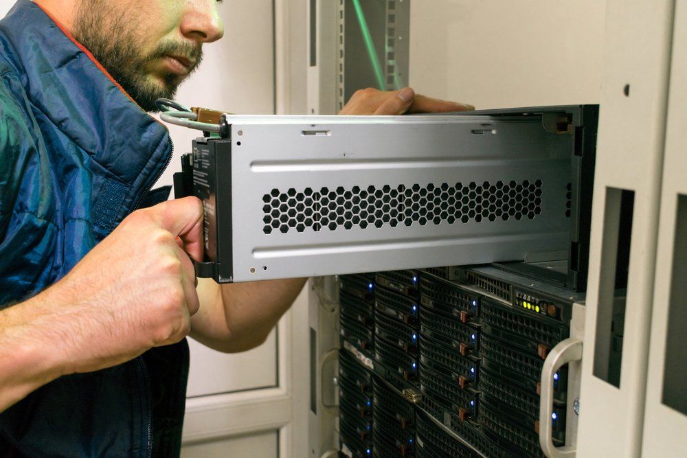a technician replacing a ups battery