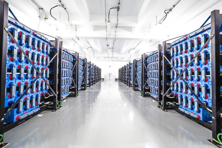 a hallway with ups batteries on either side