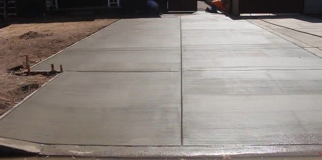 Cement driveway installation with broom-finish concrete, completed in Atlanta