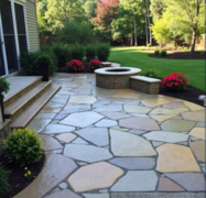 Metro Atlanta hardscape company installs multicolor stone paver backyard patio with built-in fire pit.