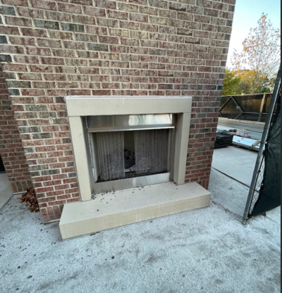 Metro Atlanta brick mason builds outdoor fireplace with brick facade and concrete mantel surround at new commercial multi-tenant property