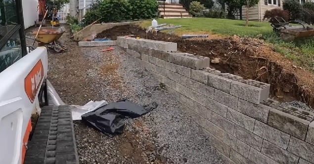 Retaining wall replacement with reinforced concrete block, completed in Atlanta