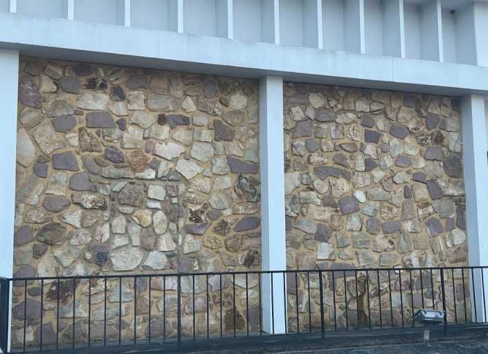 Metro Atlanta stone mason installs mixed-color multi-stone facade on commercial office building exterior