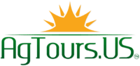 Logo of AgTours.US with a gold sun over green text.