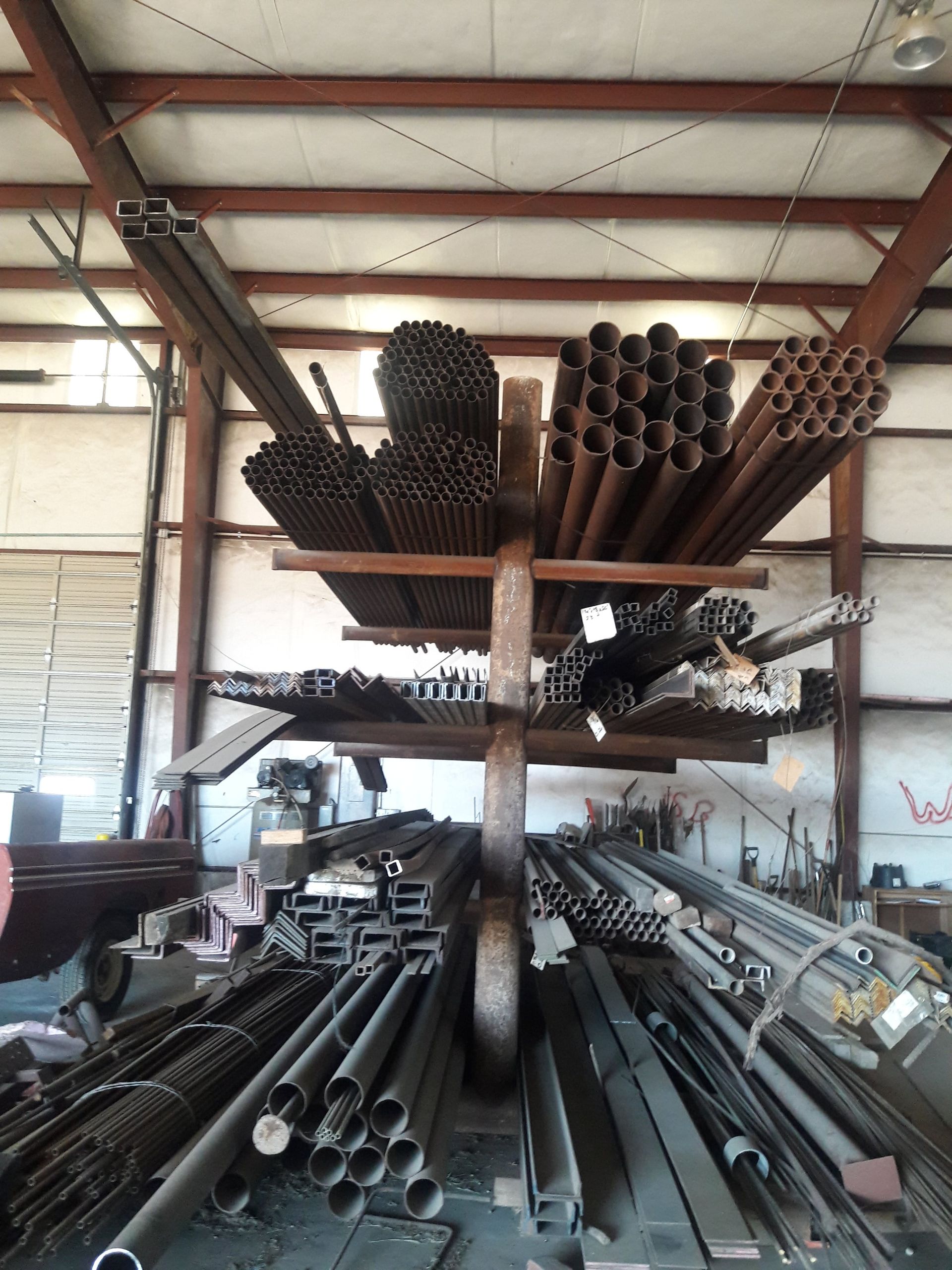 A warehouse filled with lots of metal pipes — Odessa, MO — Continental Pipe Co.