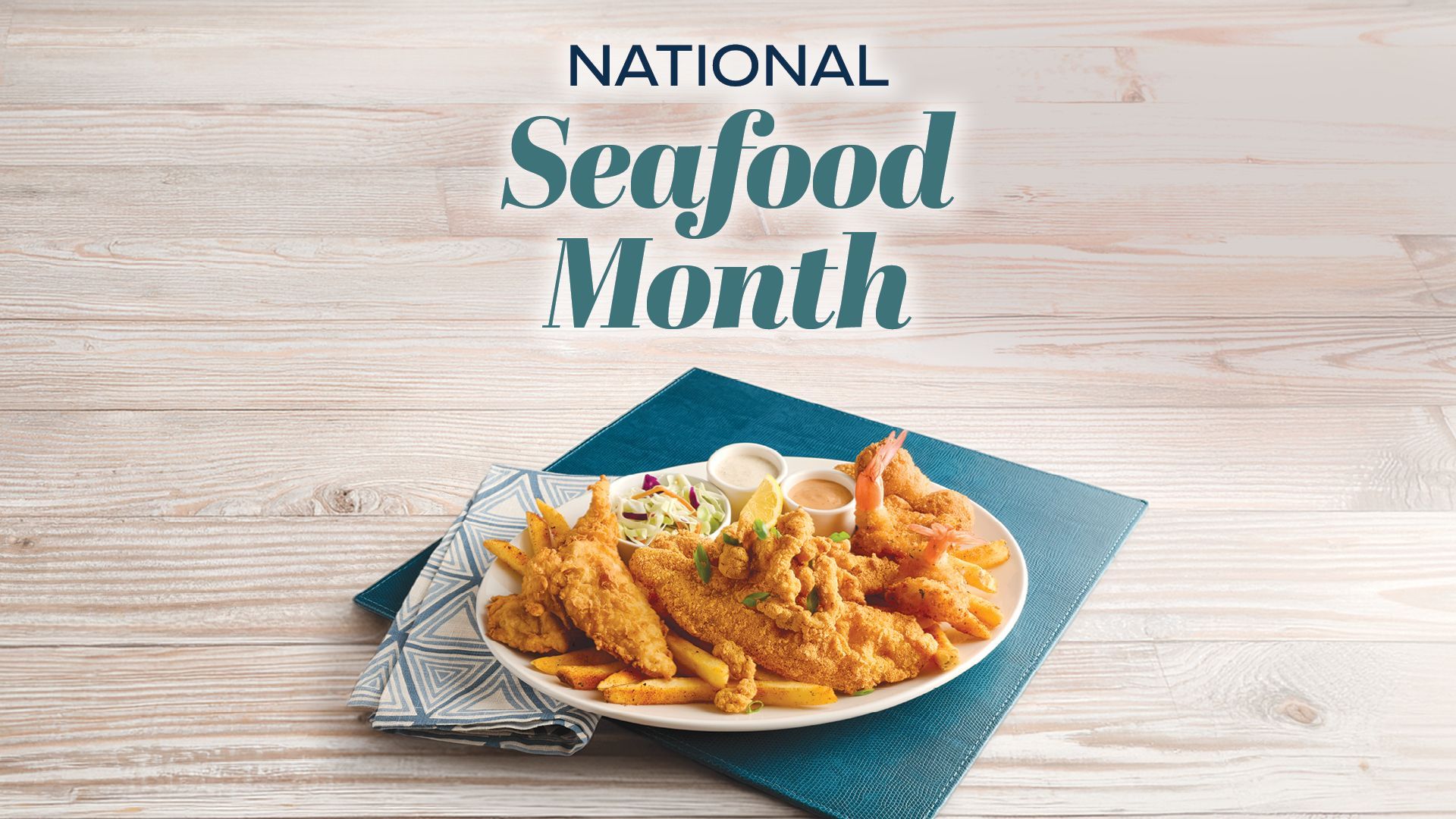National Seafood Month poster with a plate of seafood pasta on a blue napkin over a wood table.