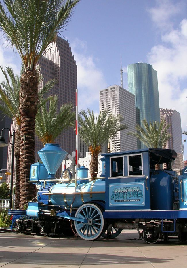A blue train with the word houston on it