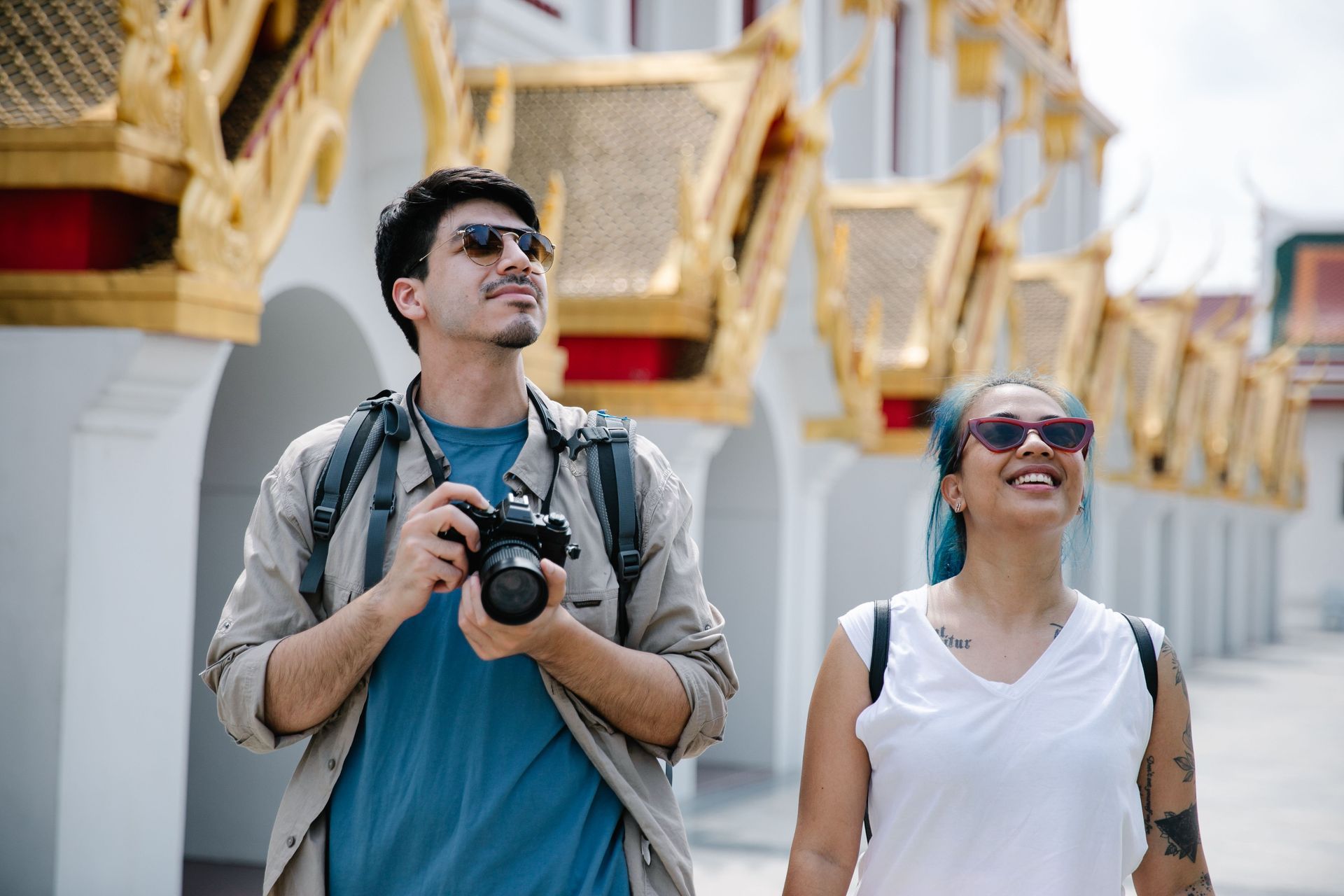 Couple smiling and relaxed at embarkation, ready for their cruise