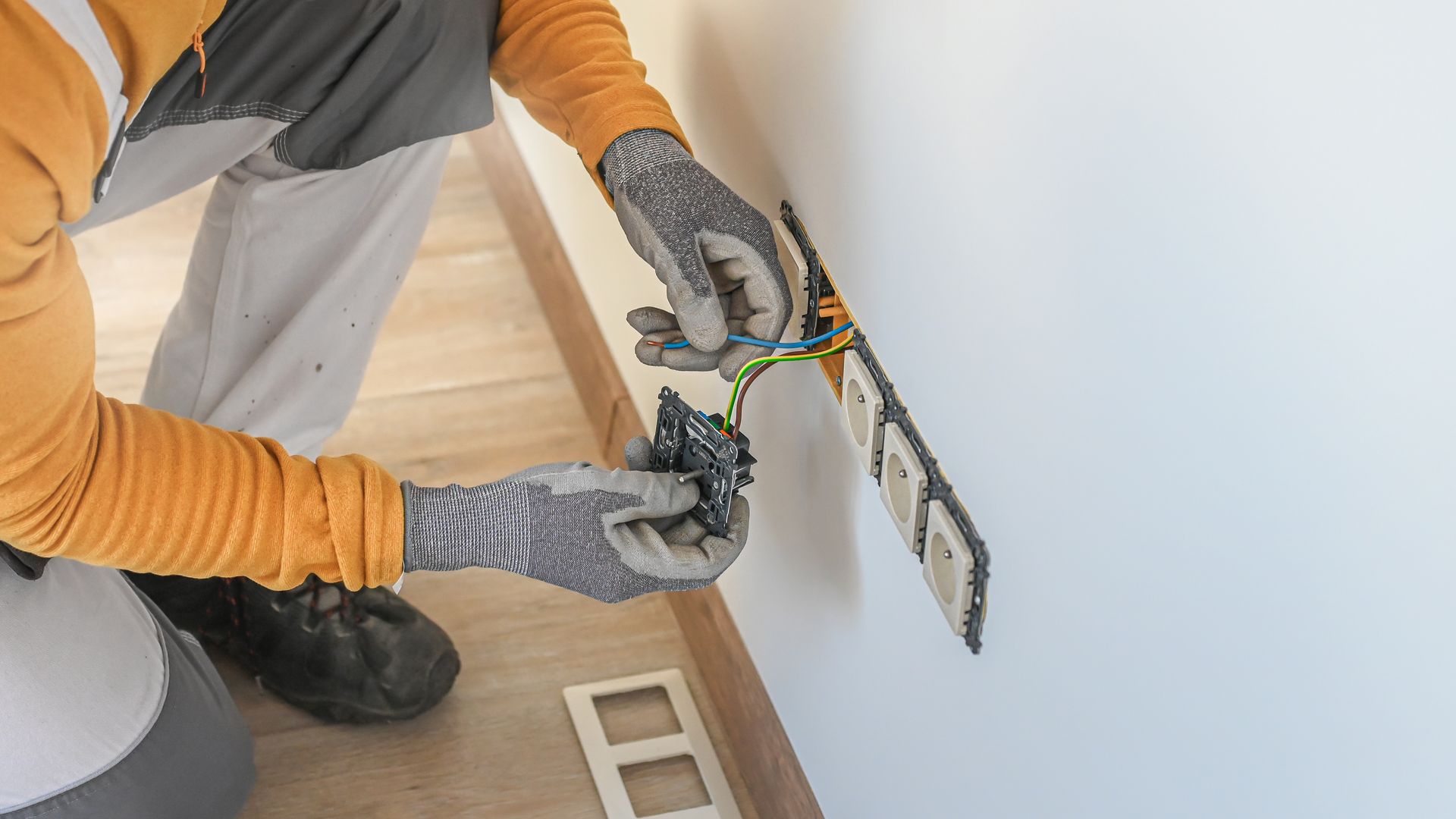 Electrical wiring repair technician fixing household electrical wiring.