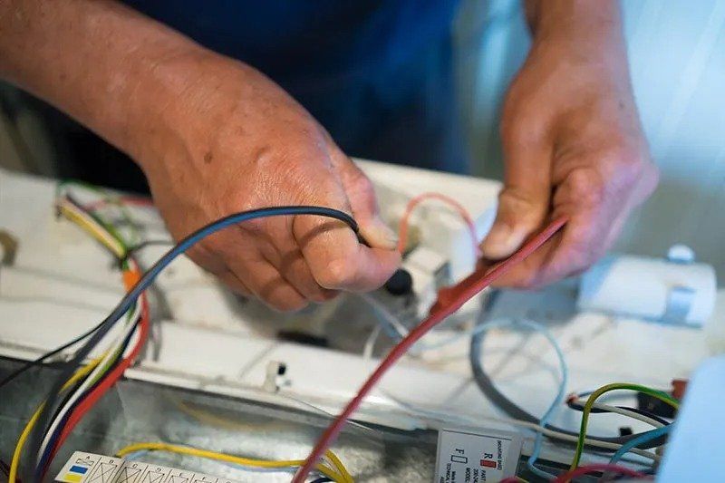 Electrician Working After Storm — Fort Lauderdale, FL — Langer Electric Service Co.