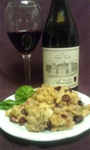 a plate of food and a bottle of wine