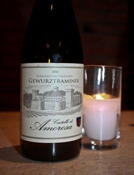 Bottle of Gewurztraminer wine next to candle