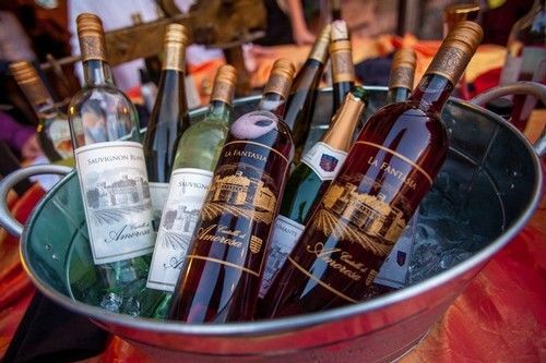 Wine bottles chilling in an ice-filled bucket