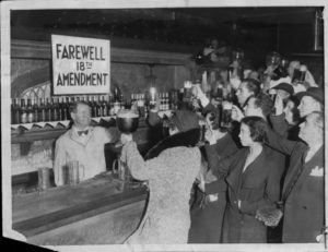 People toasting at a bar celebrating the end of Prohibition