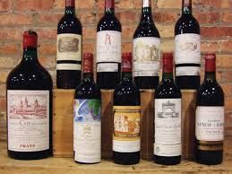 Collection of red wine bottles with different labels