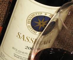 Sassicaia wine bottle with glass of red wine