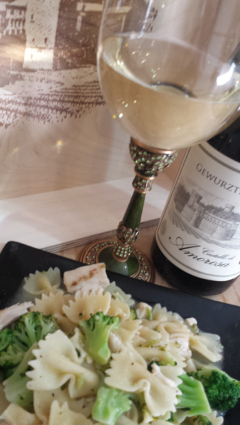 Pasta with broccoli and a glass of white wine