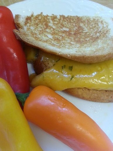 Grilled cheese sandwich with roasted peppers on plate
