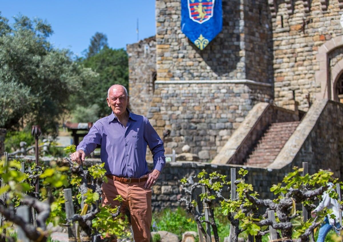 Dario Sattui standing in front of Castello di Amorosa