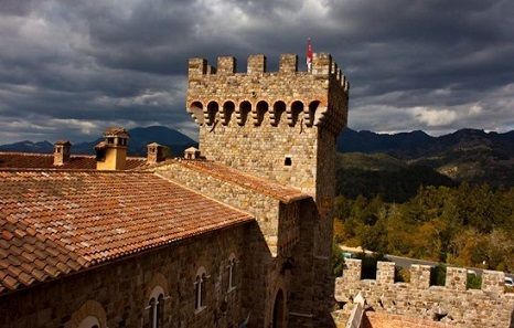 Stone castle tower with mountain background