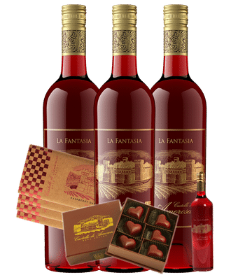 Three red wine bottles and chocolates for a gift set. Gold labels, dark red wine, and chocolates.