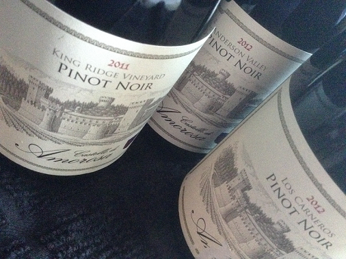 Three Pinot Noir wine bottles from different regions