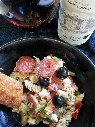 Pasta salad with salami, cheese, and olives