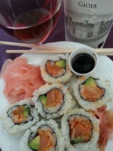 Sushi with soy sauce, ginger, and wine