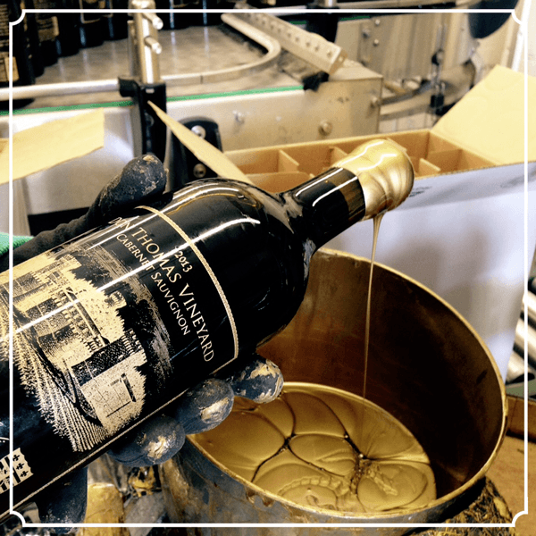 Wine bottle dipped in wax